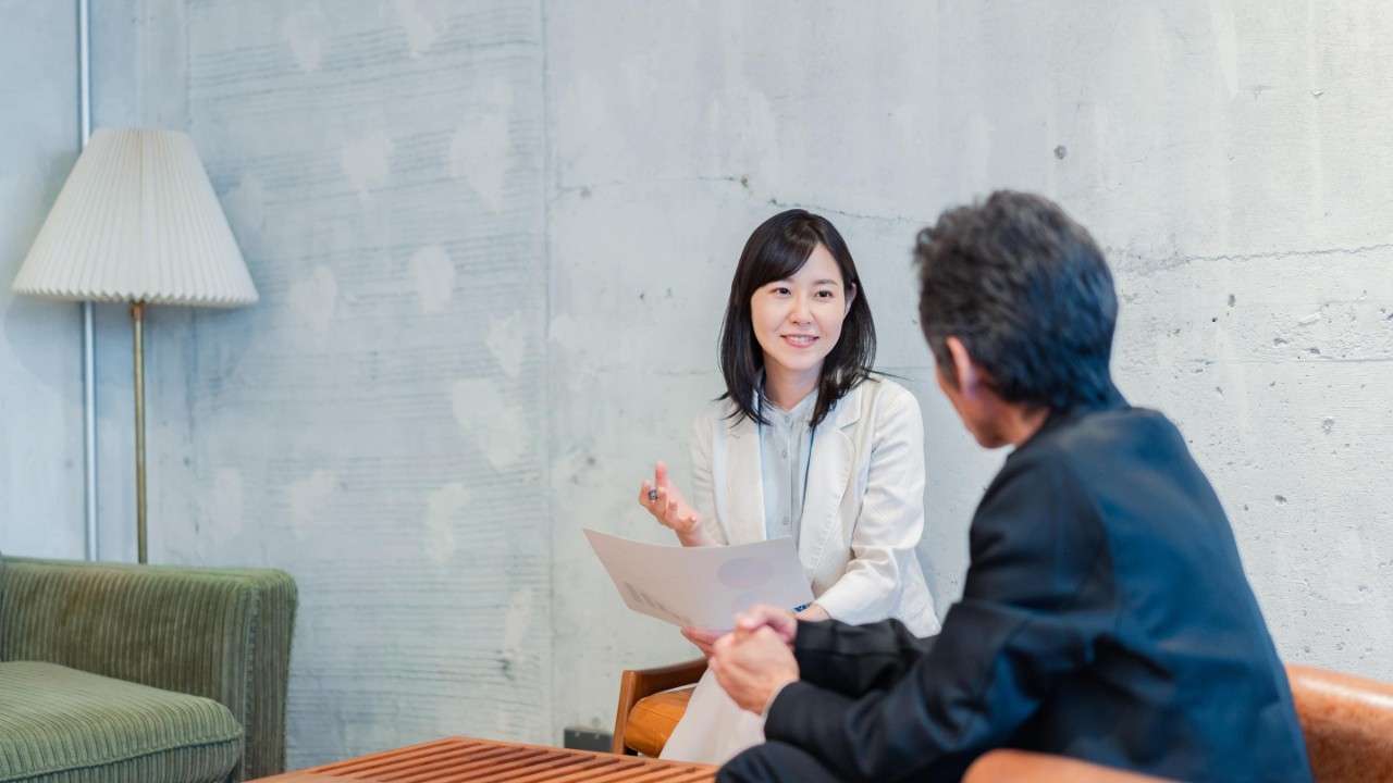 Saleswoman soliciting insurance for businessman