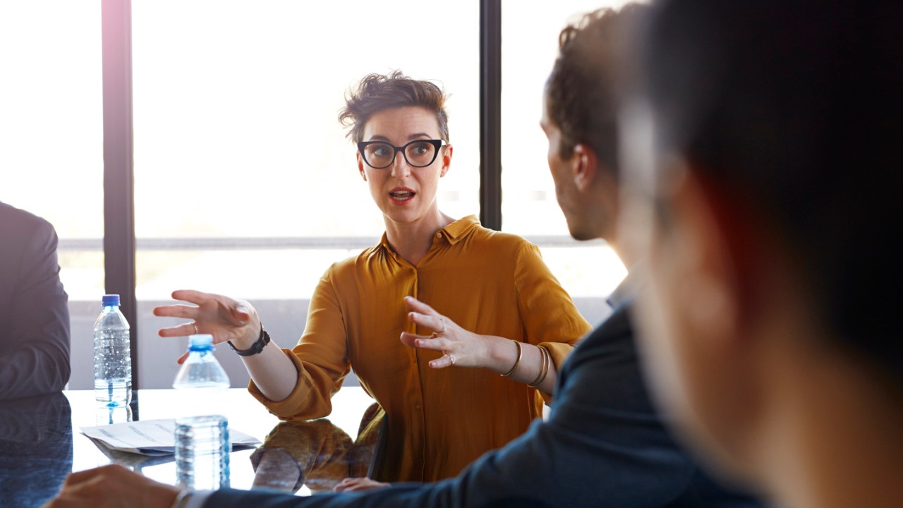 Coworker talking to colleagues