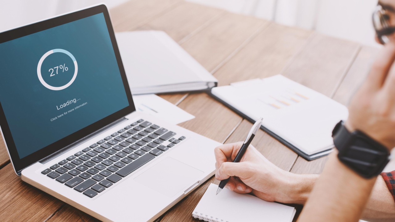 Close-up of laptop screen with loading bar
