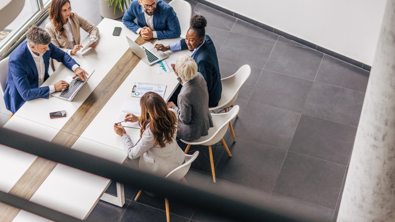 Work colleagues reviewing report at the office