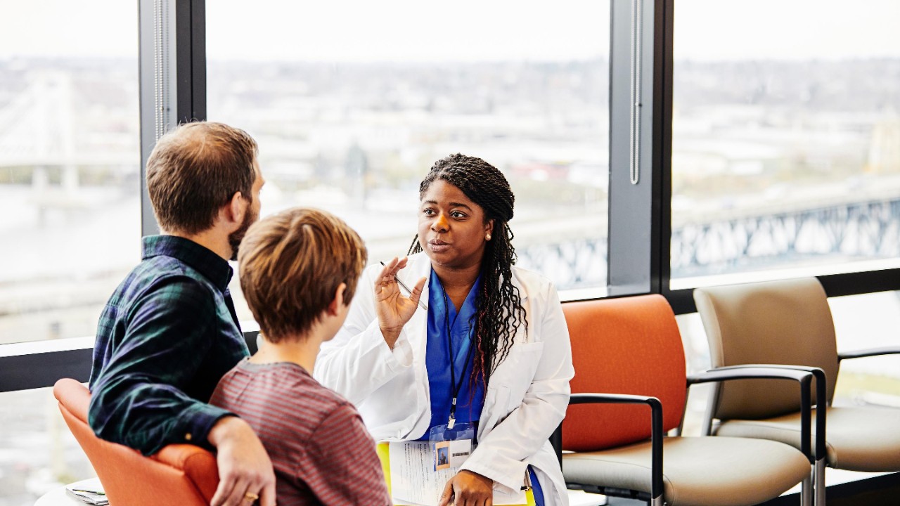 doctor talking to a couple