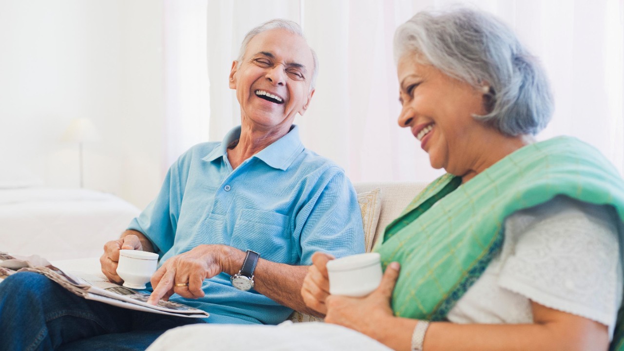 senior couple drinking tea happy talking
