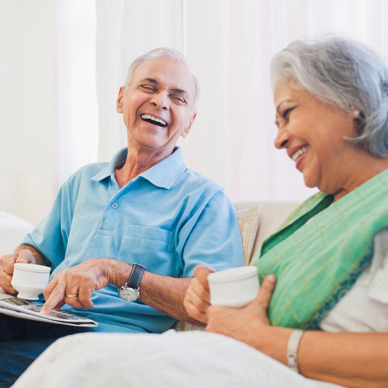 senior couple drinking tea happy talking