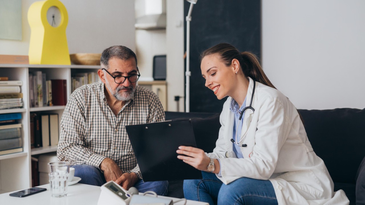A doctor and her patient review the results of an analysis