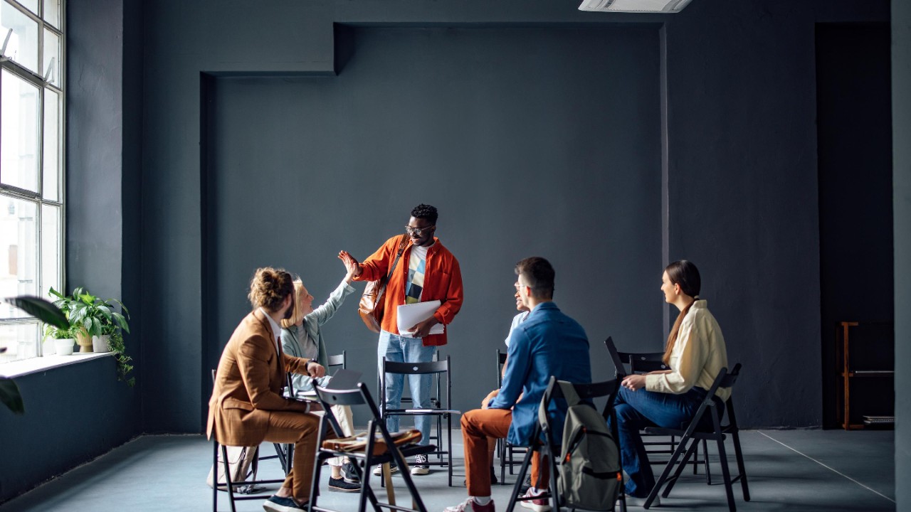 Coworkers congratulating each other