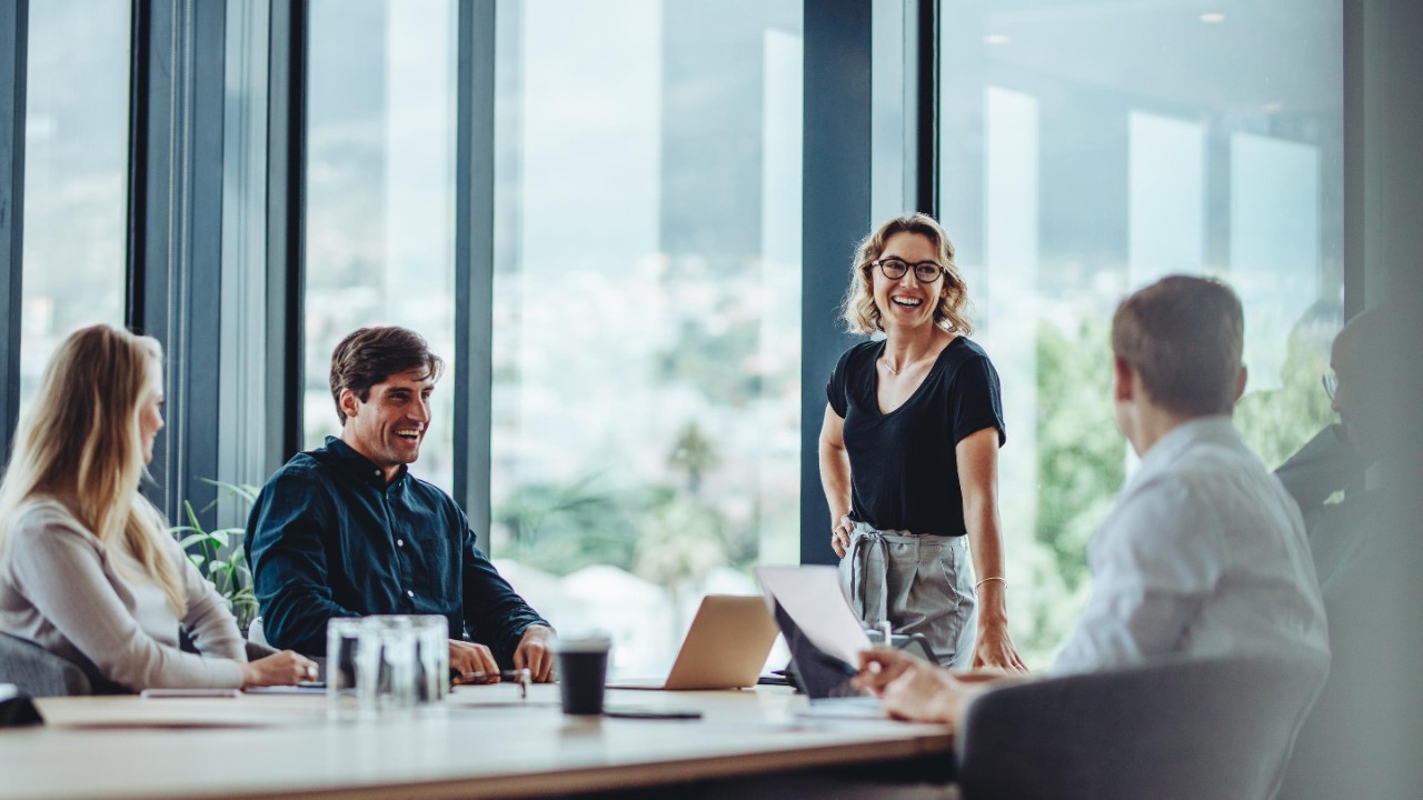 Office colleagues having casual discussion during meeting in conference room